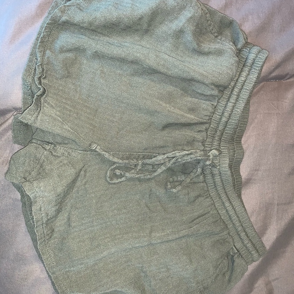 Olive colored, cotton shorts.